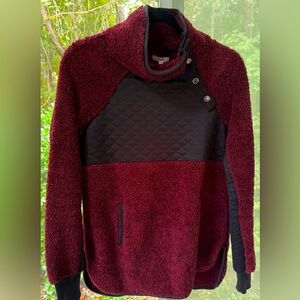 Maurice’ burgundy & black Sherpa pullover with quilted chest, snaps & pockets.